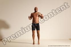 Underwear Gymnastic poses Man Black Muscular Bald Dancing Dynamic poses Academic